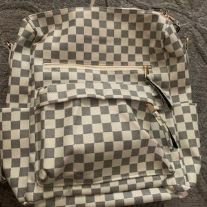 Grey and white checkered print backpack